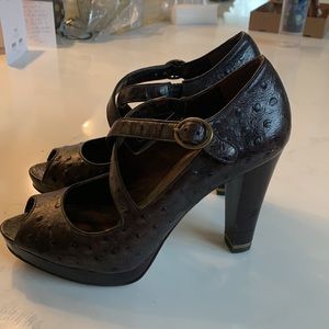 Brown ostrich pumps with brass detail on heel